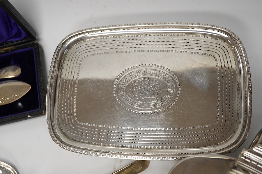 A George III silver teapot stand by Urquhart & Hart, London, 1804, an Edwardian silver mustard pot and assorted silver flatware. Condition - poor to fair to good